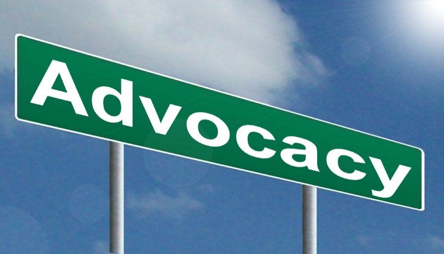 Photo of a street sign that says Advocacy